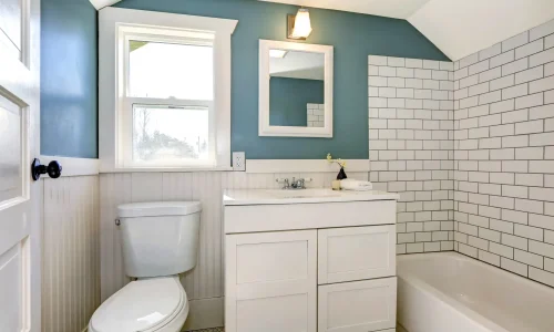 Renovated bathroom with white vanity and subway tiles by Bathroom Renovations Hamilton for Budget Bathrooms.